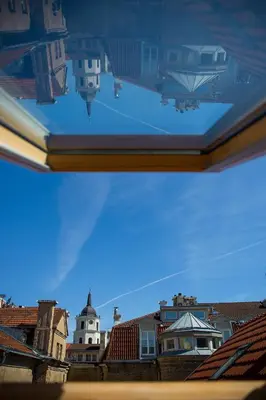 a view of the city from a book at Cathedral Sq. Apartment - Odminiu Str. in Vilnius
