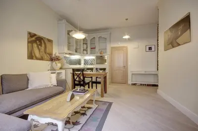 a living room with a couch and a table at Town Hall Square Apartments in Vilnius