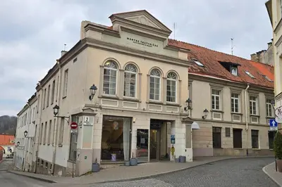 an old building on the side of a street at Town Hall Square Apartments in Vilnius