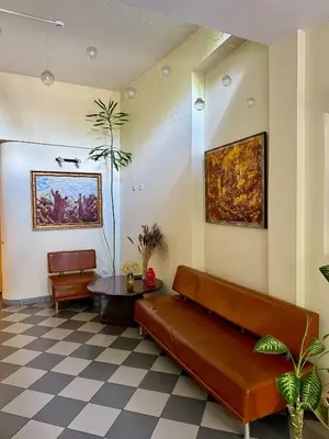 a living room with a couch and a table at Velga in Vilnius