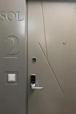 a metal door with the number on it at Korio Apartments, Druskininkai in Druskininkai