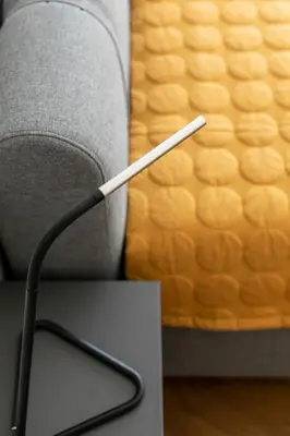 a white wire sticking out of a gray chair at Korio Apartments, Druskininkai in Druskininkai
