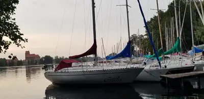 a group of sailboats are docked in a harbor at 2 kambarių apartamentai su virtuve, Trakų miesto centre in Trakai