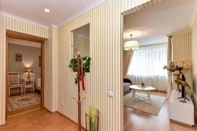 a hallway with striped walls and a room at 2 kambarių apartamentai su virtuve, Trakų miesto centre in Trakai