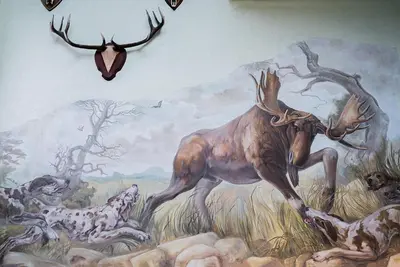 a mural of a moose on a wall at Šiauliu Krasto Medžiotojų Užeiga in Šiauliai