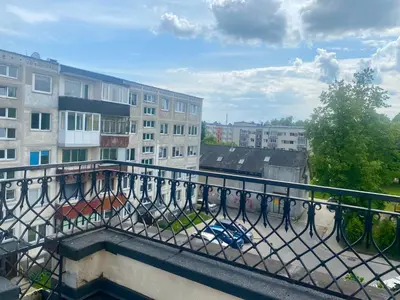 a balcony with a view of a city with buildings at Turnė in Šiauliai