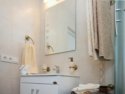 a bathroom with a sink and a mirror at Skapas Street Vilnius in Vilnius