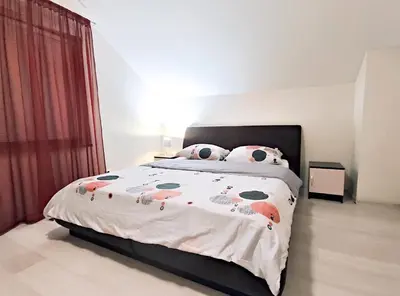 a bed with hello kitty pillows on it in a bedroom at K-Town - Apartment near the Lake in Kaunas