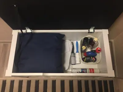 a drawer in a bed with tools in it at Modern 2 Rooms Apartment in Kaunas