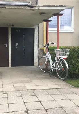a bike parked in front of a building at Modern 2 Rooms Apartment in Kaunas