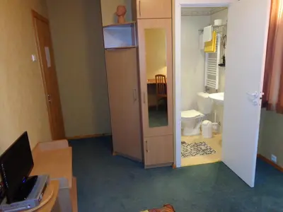 a small room with a bathroom with a toilet at Home B&B in Kaunas