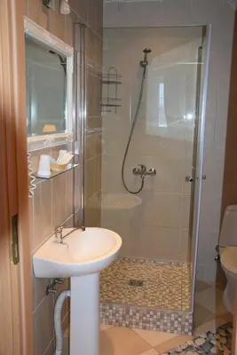 a bathroom with a sink and a shower at Girele in Šiauliai
