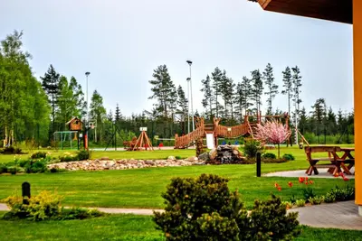 a park with a playground with a slide at Girele in Šiauliai