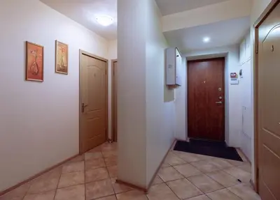 a hallway with two doors and a hallway with a door at Mara in Vilnius