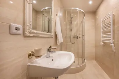 a bathroom with a sink and a shower at Kesminta Šalčininkai in Šalčininkai