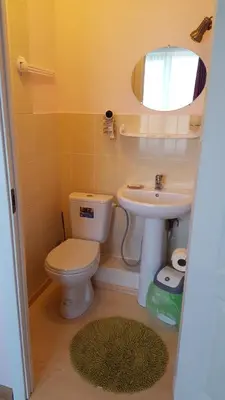 a bathroom with a toilet and a sink at Vijuandra in Zarasai