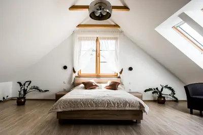 a bedroom with a bed and a window at Prie Žiedo in Trakai