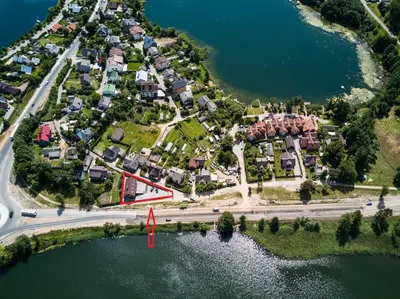 an aerial view of a village on a lake at Prie Žiedo in Trakai