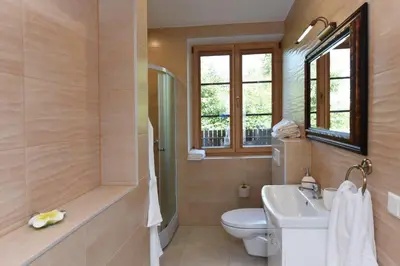 a bathroom with a toilet and a sink and a shower at Prie Žiedo in Trakai