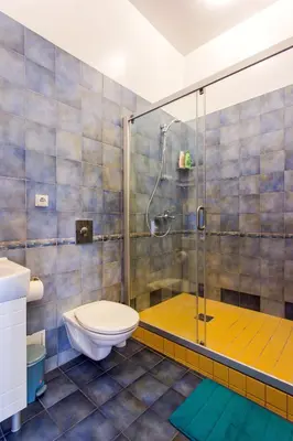 a bathroom with a toilet and a shower at #stayhere - Cozy & Comfy 1BDR Apartment Vilnius Old Town in Vilnius