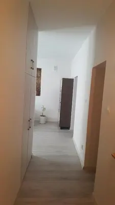 a hallway with two brown doors in a room at Apartment on Kudirkos 20 in Vilnius