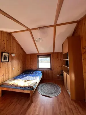 a bedroom with a bed in a room at Villa in Vistytis in Vištytis