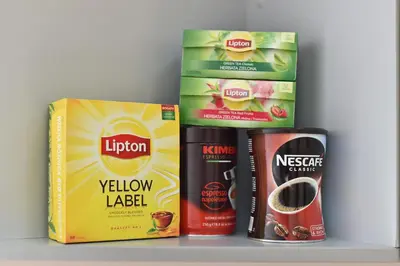 three boxes of food sitting on a shelf at Laisves Avenue Hostel 