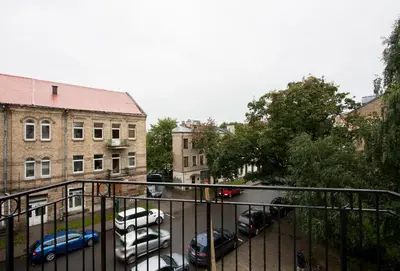 a view of a parking lot with parked cars at 9010 Apartments in Vilnius