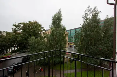 a view from a balcony of a street with trees at 9010 Apartments in Vilnius
