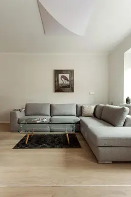 a living room with a couch and a table at #stayhere - Spacious 2BDR Two Floor I Heart of Old Town in Vilnius