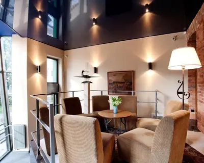 a living room with chairs and a table at BEST WESTERN Santakos Hotel in Kaunas