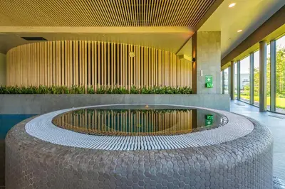 a building with a large circle in the middle of a building at Vilnius Grand Resort in Ežeraičiai