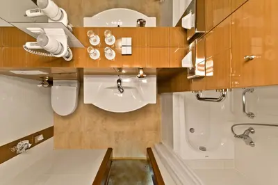 a bathroom with a sink and a toilet and a shower at Best Western Vilnius in Vilnius