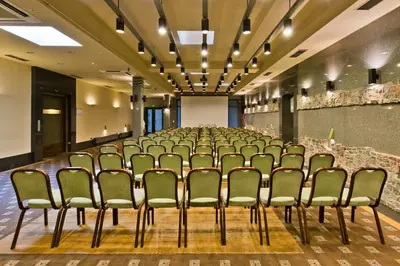 an empty room with a row of chairs in it at Best Western Vilnius in Vilnius
