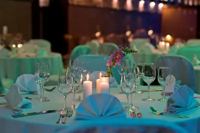 a table with wine glasses and candles on it at Best Western Vilnius in Vilnius