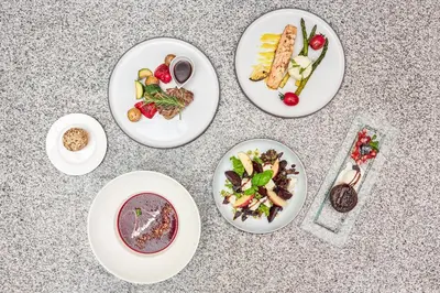a group of plates of food on a table at Ratonda Centrum Hotels in Vilnius