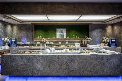 a buffet line with many plates of food at VILNIUS PARK PLAZA HOTEL & SPA, Restaurant, Panorama Bar, Conference & Banquet Center in Vilnius