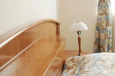 a stairway with a lamp next to a stair case at Amicus Hotel in Vilnius