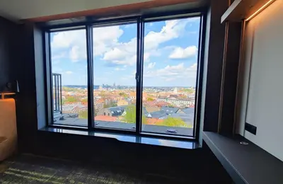 a room with a large window with a view at Hotel Panorama in Vilnius