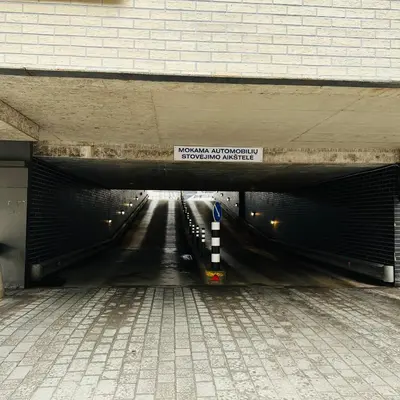 a subway tunnel with a sign that reads subway underground parking authority at City Hotels Rūdninkai in Vilnius