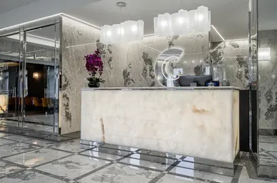 a lobby with a reception desk in a building at Congress Hotel in Vilnius