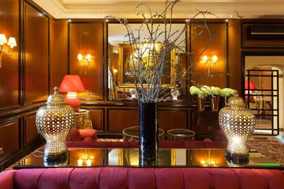 a living room with two vases on a table at NARUTIS Hotel - Small Luxury Hotels of The World in Vilnius