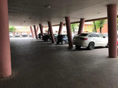 a parking lot with cars parked in a parking garage at Kaunas in Kaunas
