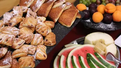 a bunch of different types of bread and fruit at BEST BALTIC Kaunas in Kaunas