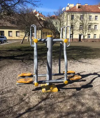 an empty playground with a bunch of swings at Natalex Apartments in Vilnius