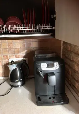 a coffee maker and a toaster on a kitchen counter at Natalex Apartments in Vilnius