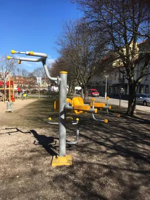 a metal object in a park with a playground at Natalex Apartments in Vilnius