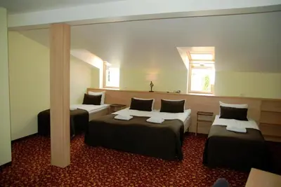 a hotel room with two beds and a window at City Gate in Vilnius