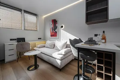 a living room with a couch and a table at Vilnius City Hotel in Vilnius