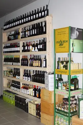 a store filled with lots of bottles of wine at Hotel Babilonas in Kaunas